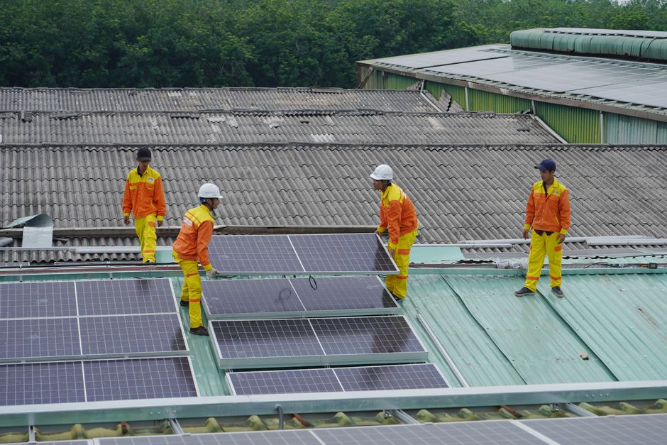 Professional solar installation crew working on residential rooftop