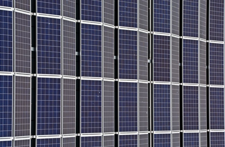 Residential solar installation showing proper flashing and weatherproofing connections on a pitched roof.