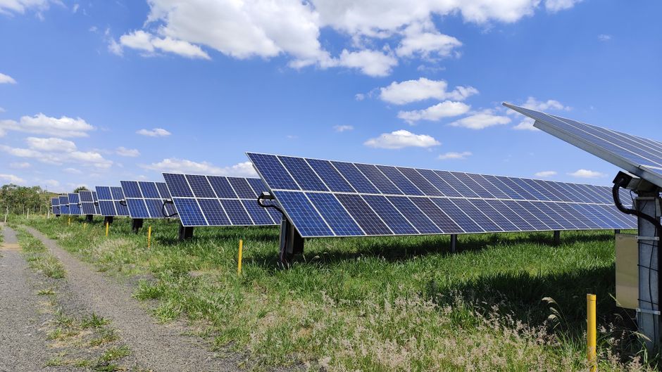 Expert solar technician installing panels with professional safety equipment